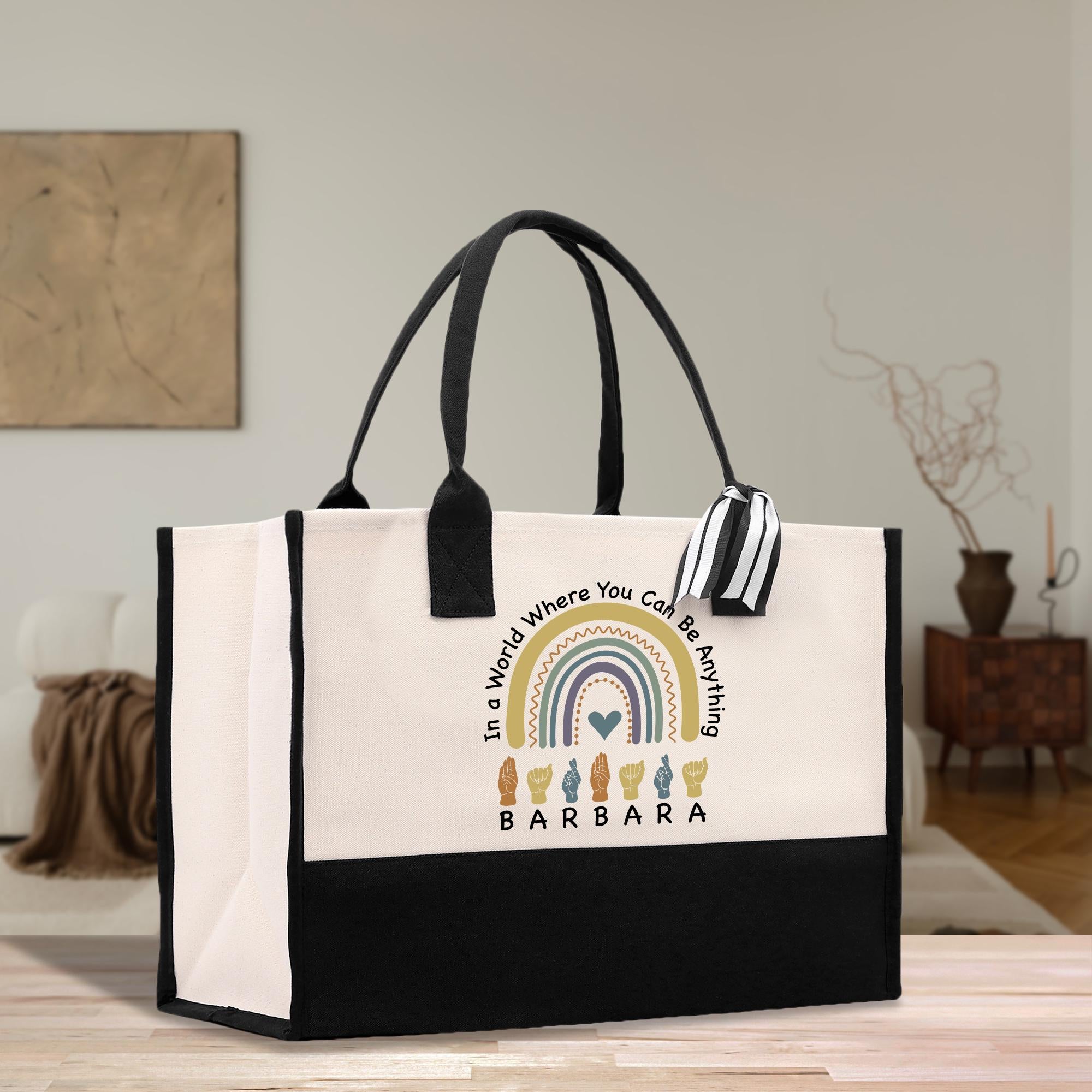 a black and white bag with a rainbow on it