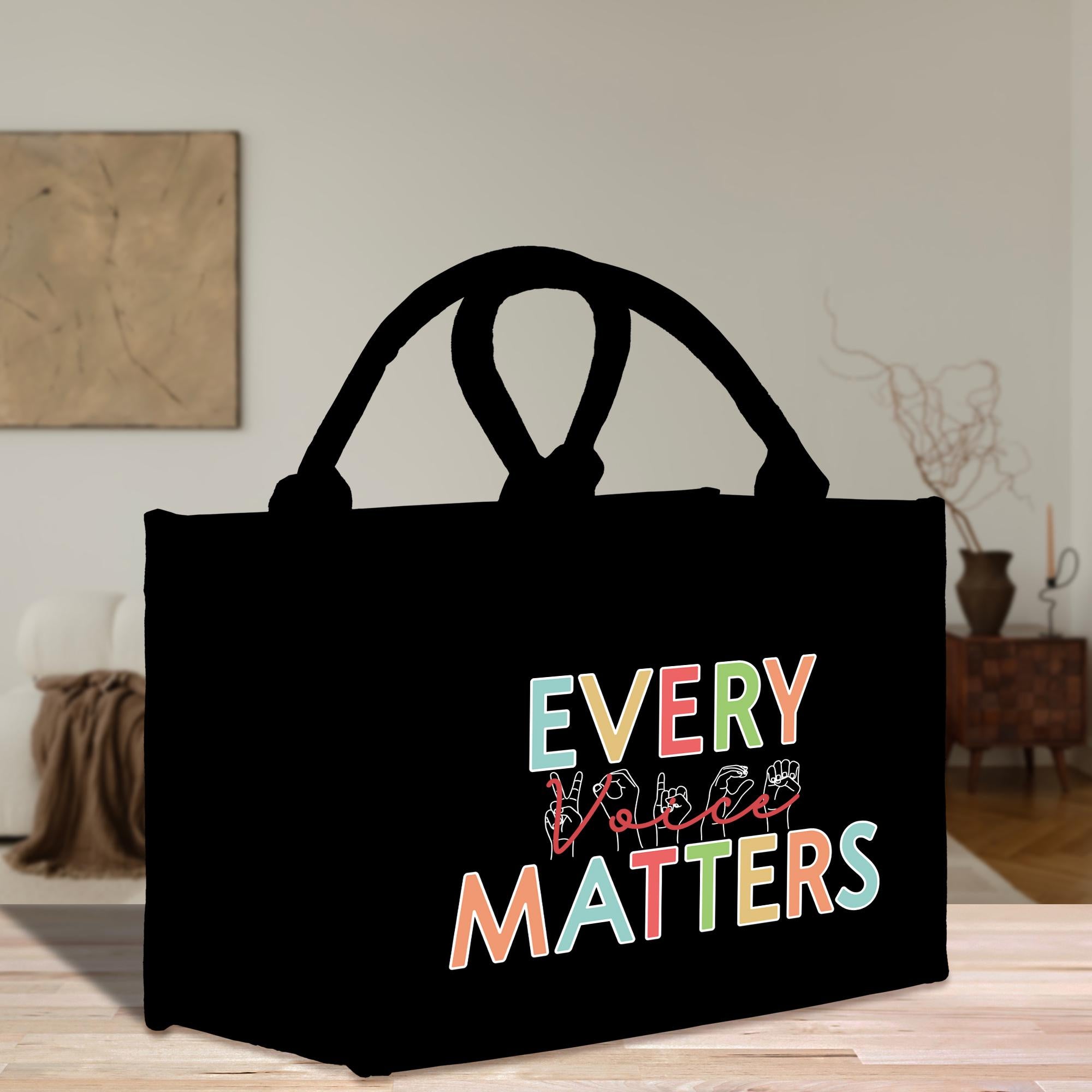 a black shopping bag with the words every little matters printed on it