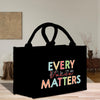 a black shopping bag with the words every little matters printed on it