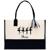 a black and white tote bag with three ballerinas on it