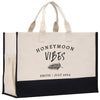 a black and white shopping bag with the words honeymoon vibes printed on it