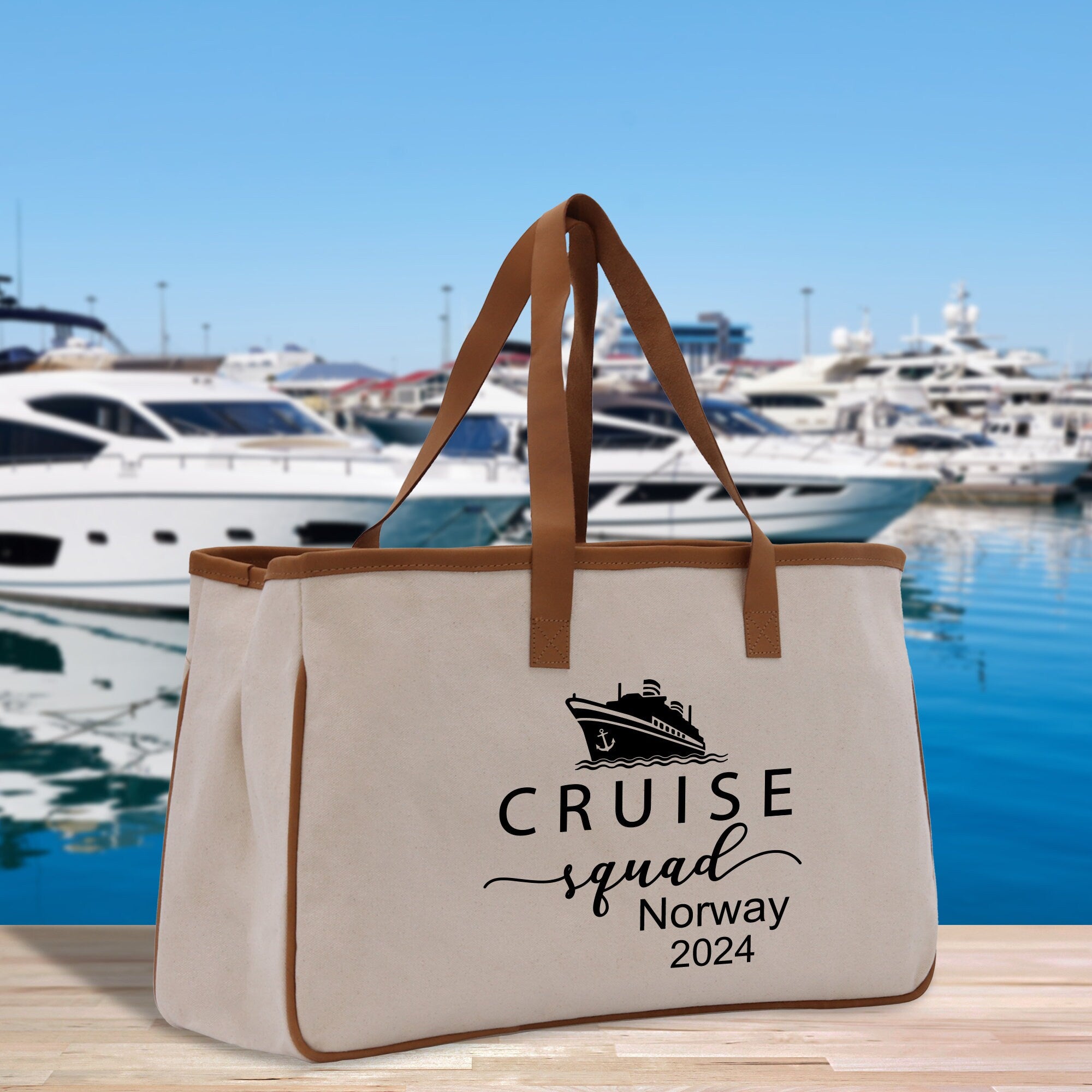 a canvas tote bag with a cruise ship in the background