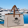 a canvas tote bag with a cruise ship in the background