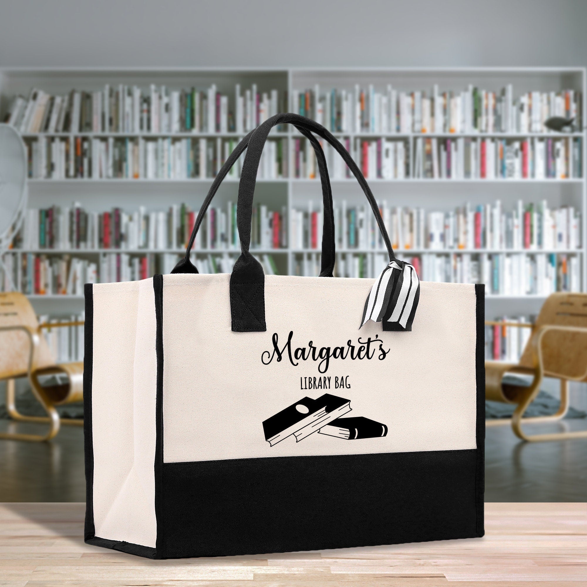 a black and white bag sitting on top of a wooden table