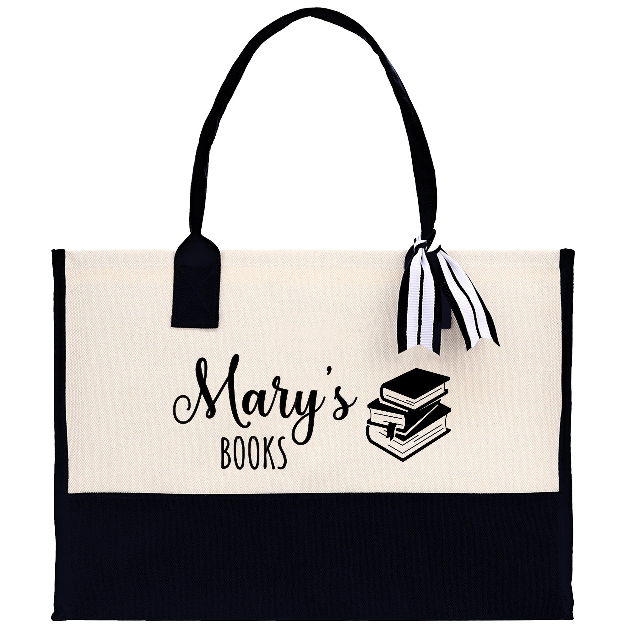 a black and white bag with a book on it