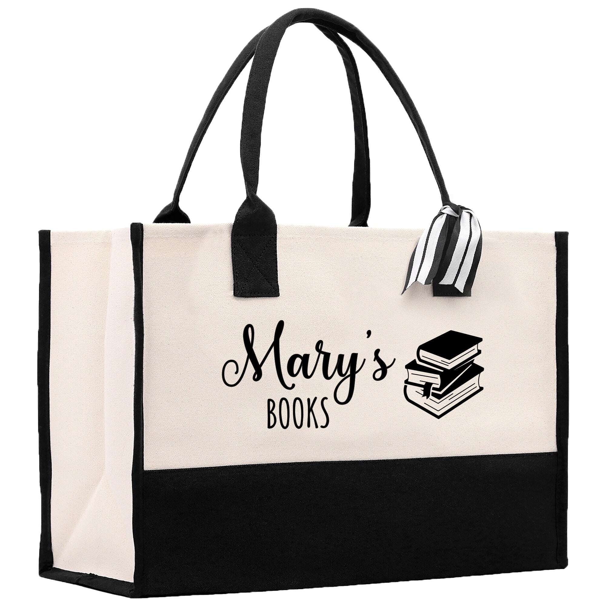 a black and white bag with a book on it