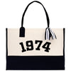 a black and white tote bag with a black and white striped handle