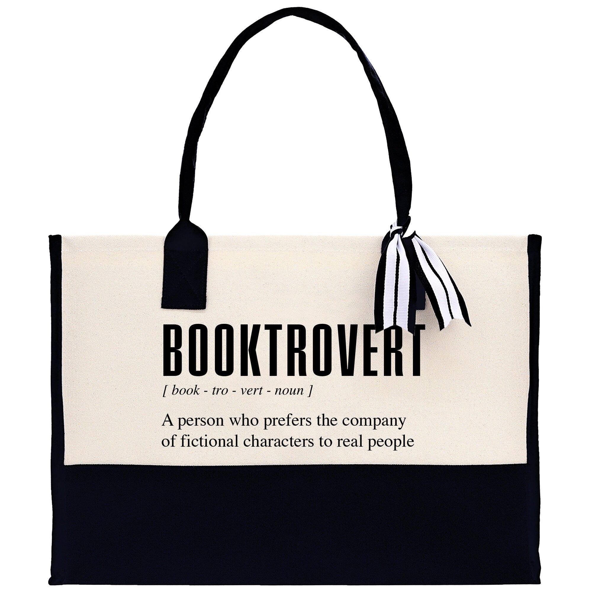 a black and white book tote bag with a quote on it