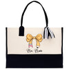 a black and white bag with a bow on it