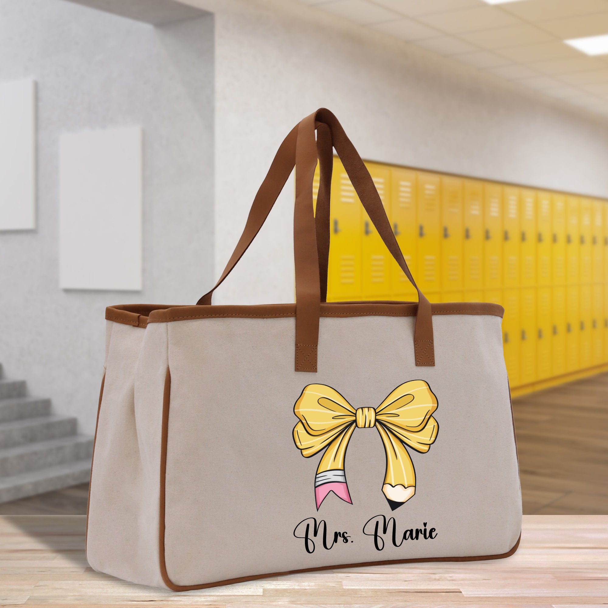 a canvas bag with a bow and name on it