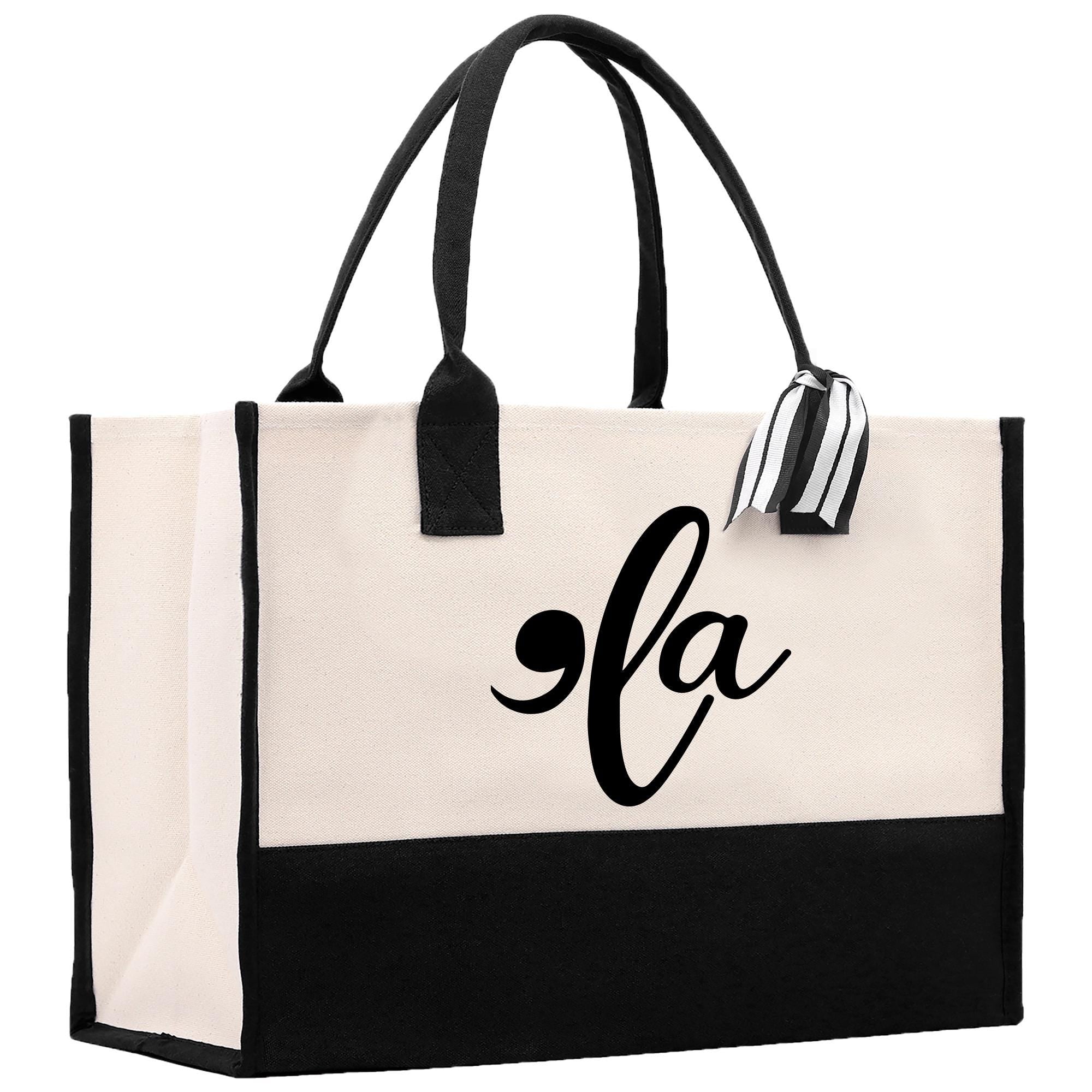 a black and white tote bag with the letter fa on it