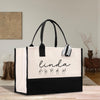 a black and white shopping bag with the name lindaa on it