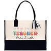 a black and white bag with a teacher's name on it