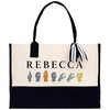 a white and black bag with a black handle