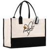 a black and white tote bag with a football mom on it