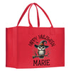 a red shopping bag with an owl wearing a witches hat