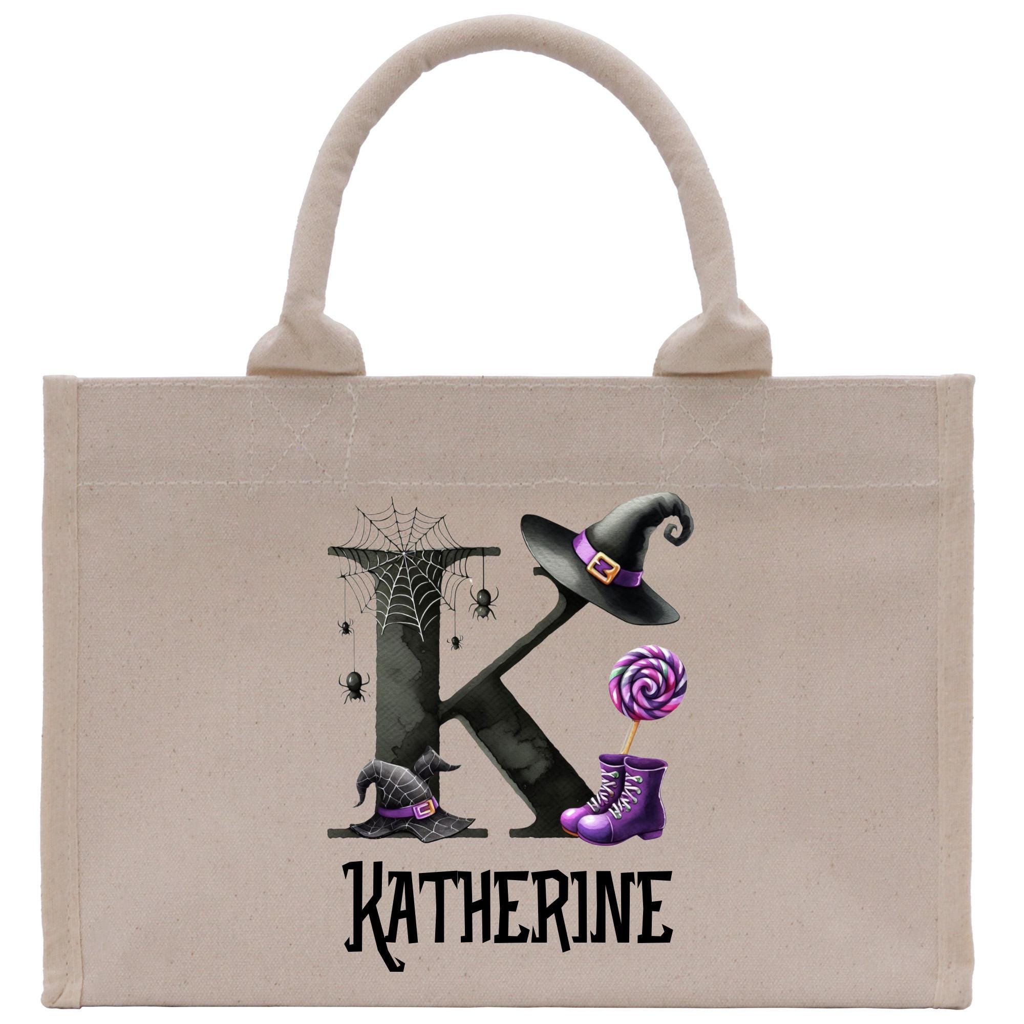 a tote bag with a picture of a witch holding a lollipop