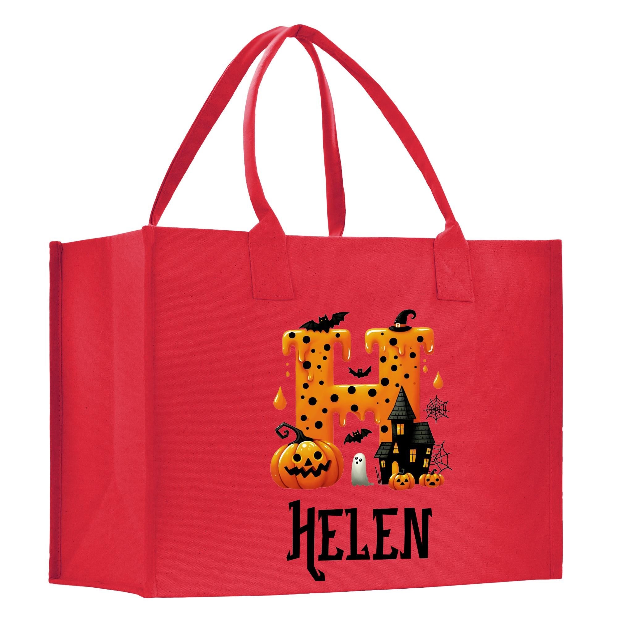 a red shopping bag with a picture of a house and pumpkins