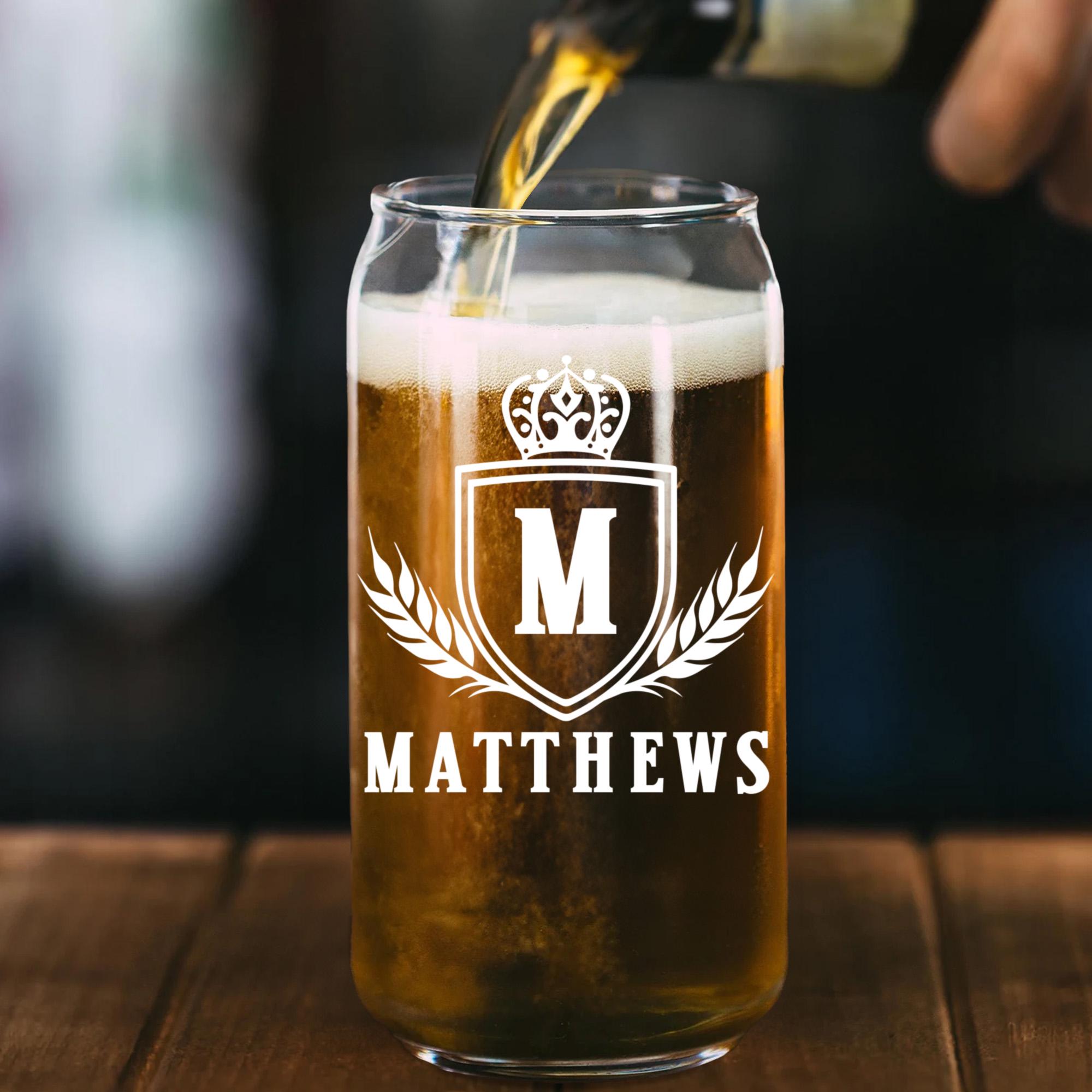 a person pouring a beer into a glass