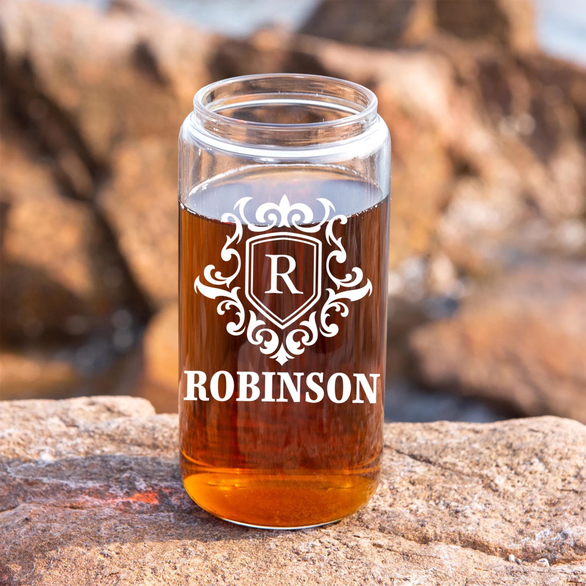 a mason jar filled with liquid sitting on top of a rock