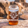 a mason jar filled with liquid sitting on top of a rock