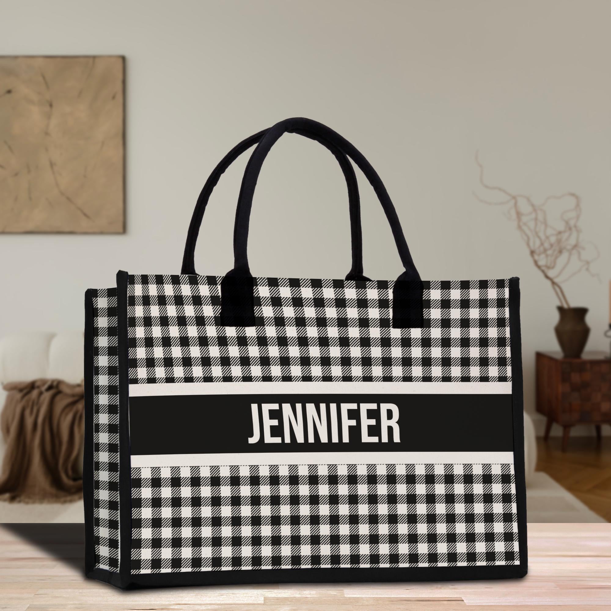 a black and white bag sitting on top of a wooden table