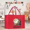 a red shopping bag with a halloween scene on it