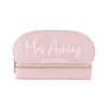 a pink makeup bag with a name on it