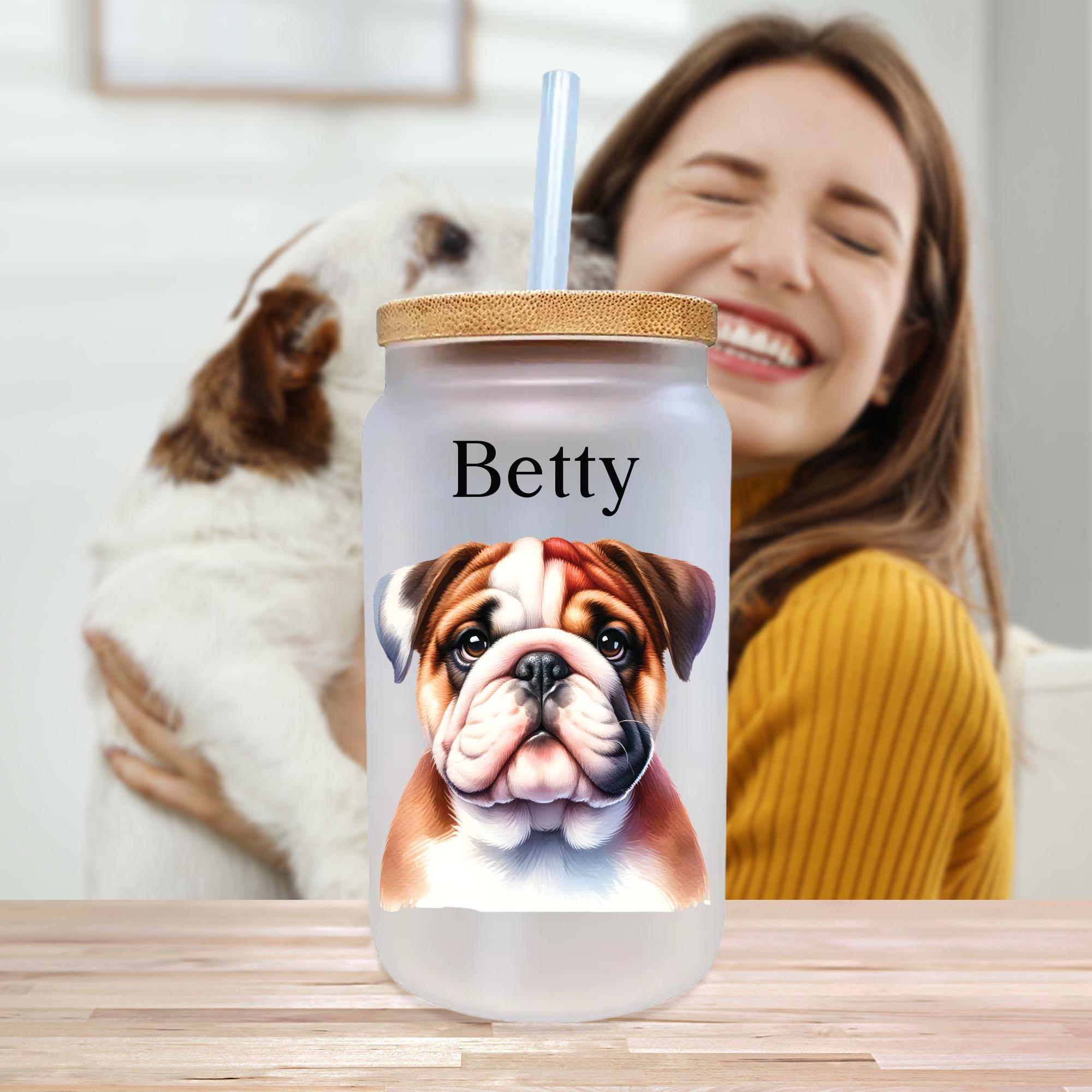 a woman sitting at a table with a dog next to her