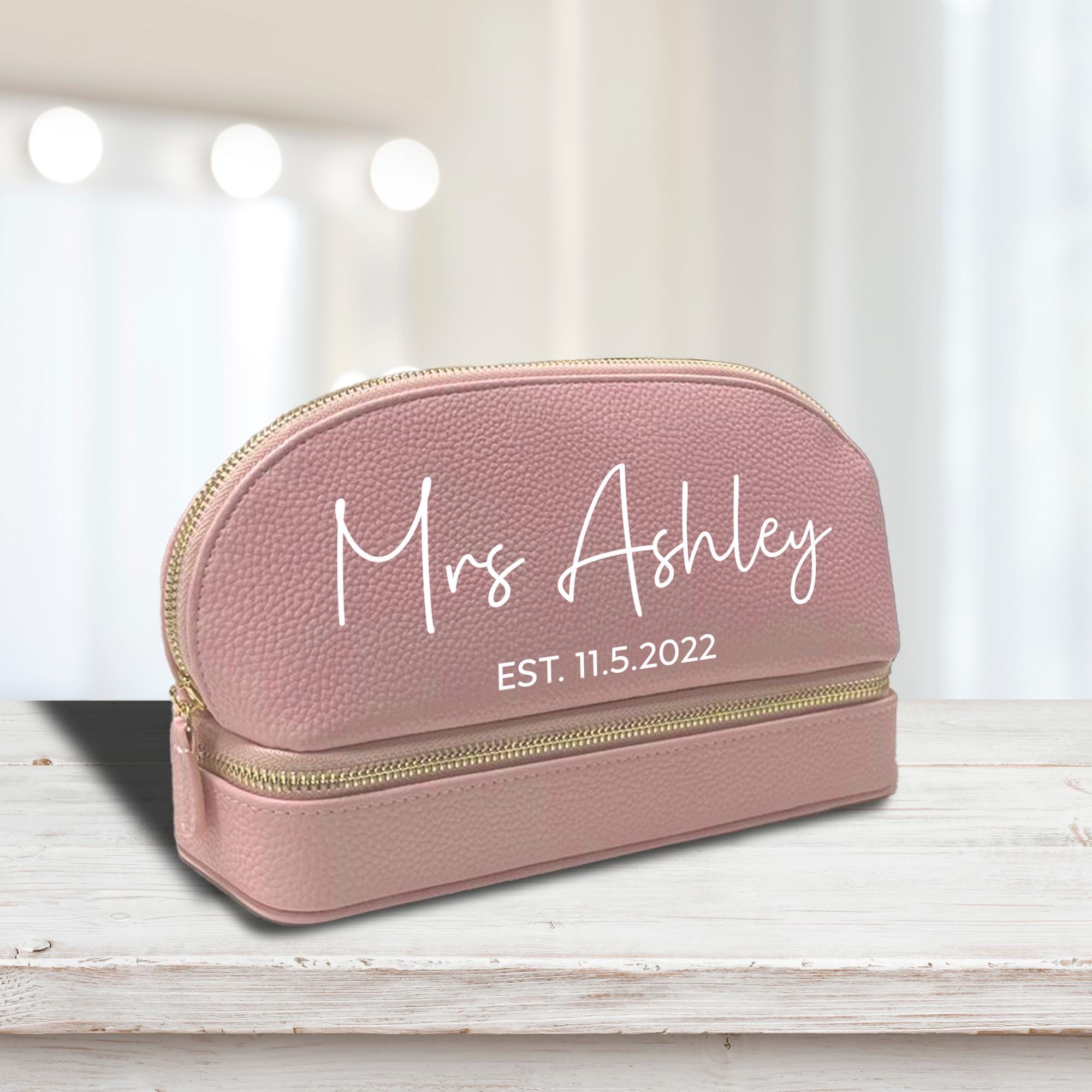 a pink makeup bag with the name mrs ashley on it