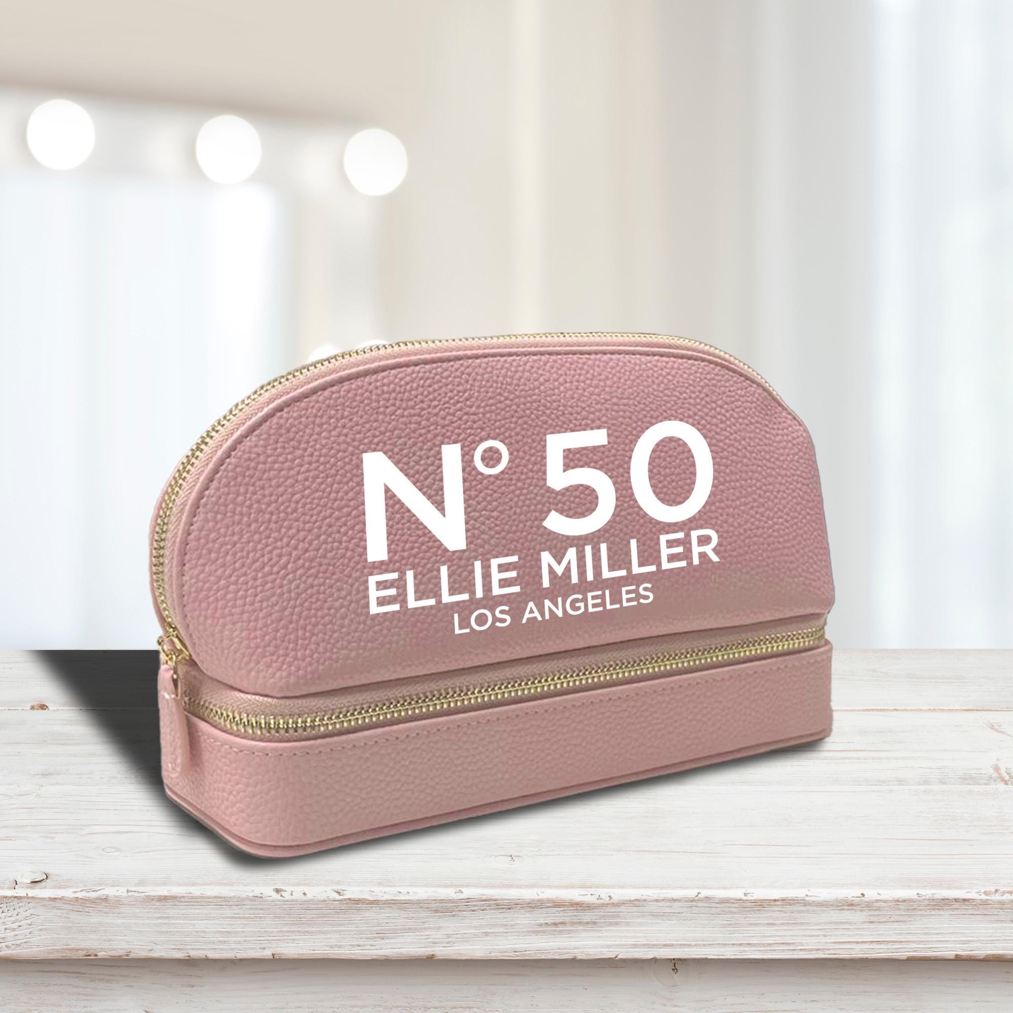 a pink cosmetic bag with the number 50 on it