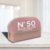 a pink cosmetic bag with the number 50 on it