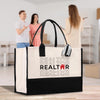 a woman and a man are standing behind a realtor bag