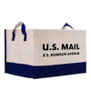 a white and blue bag with the u s mail printed on it