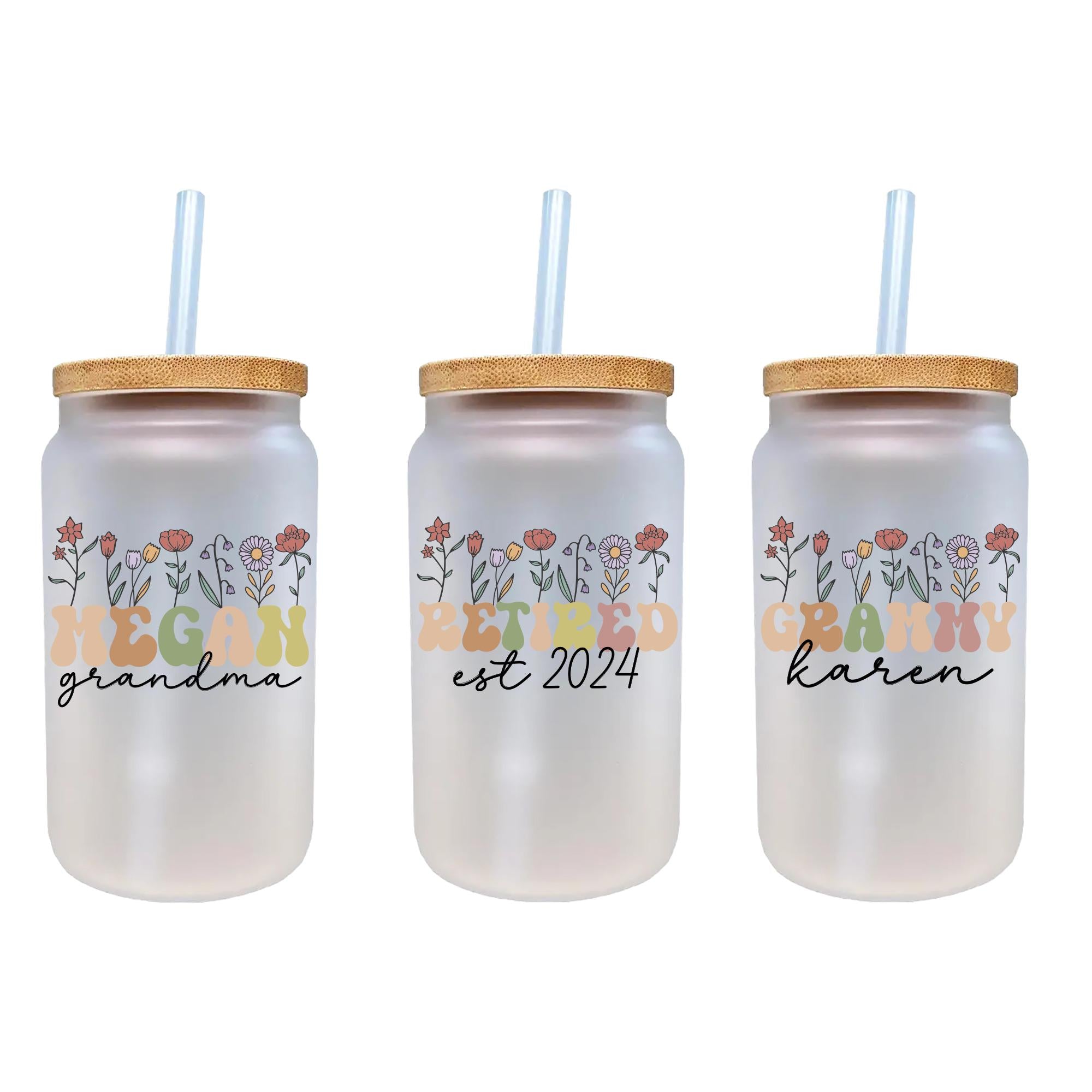 three personalized mason jars with straw tops