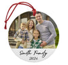 a family ornament with a picture of a man, woman, and two