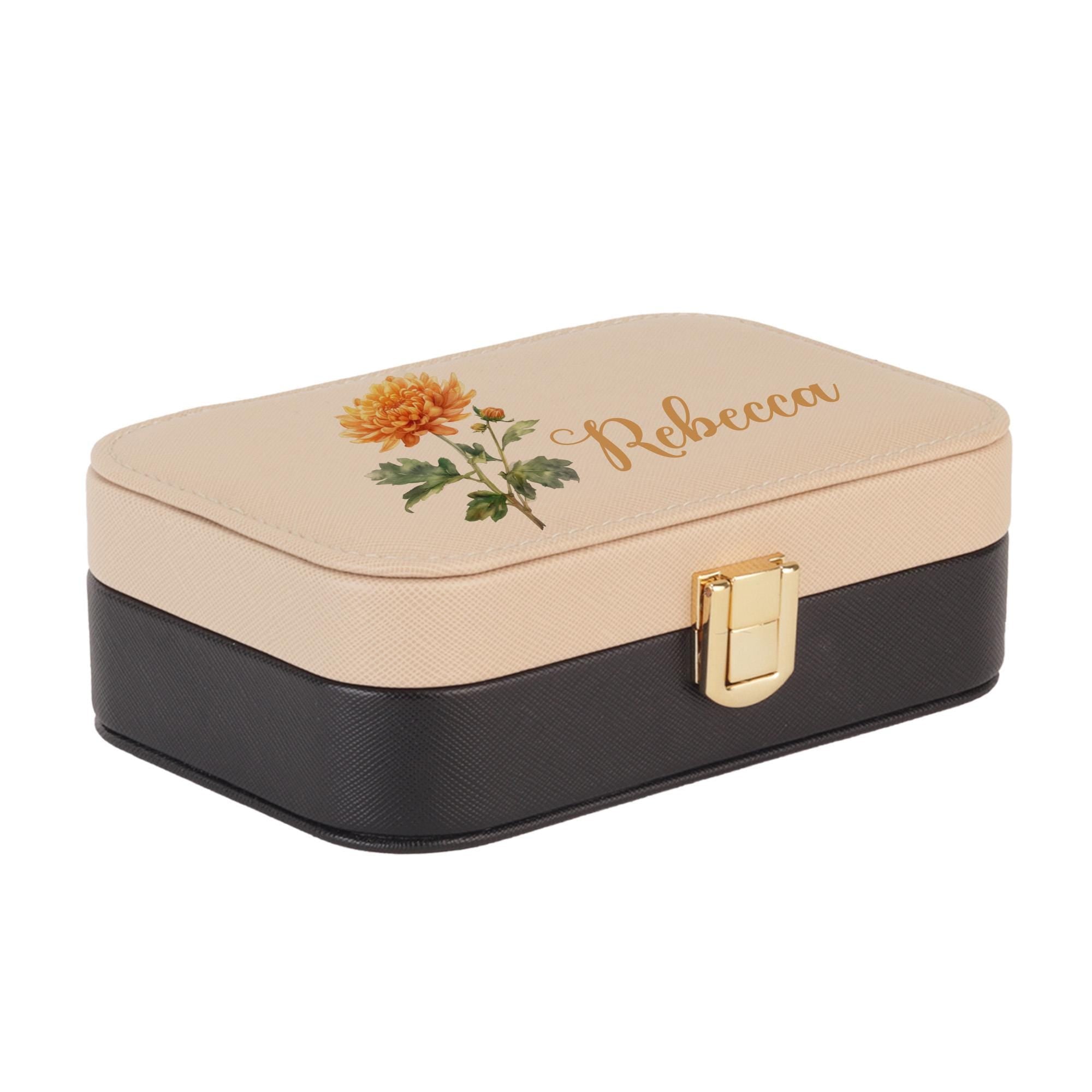 a black and white box with a flower on it