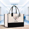 a white and black bag with a heart and a name on it