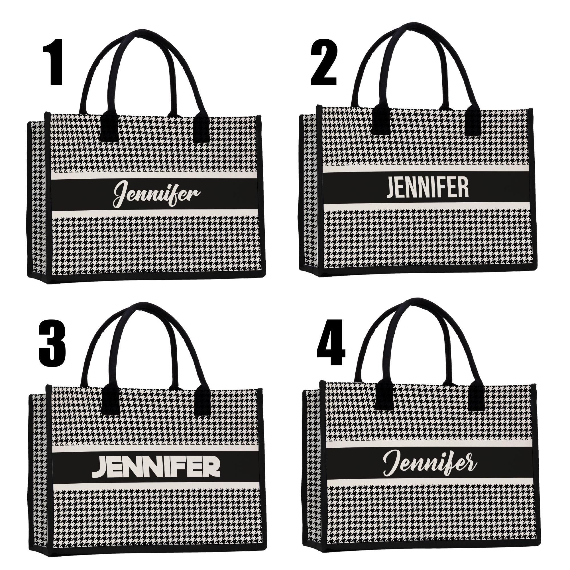 a set of four black and white shopping bags