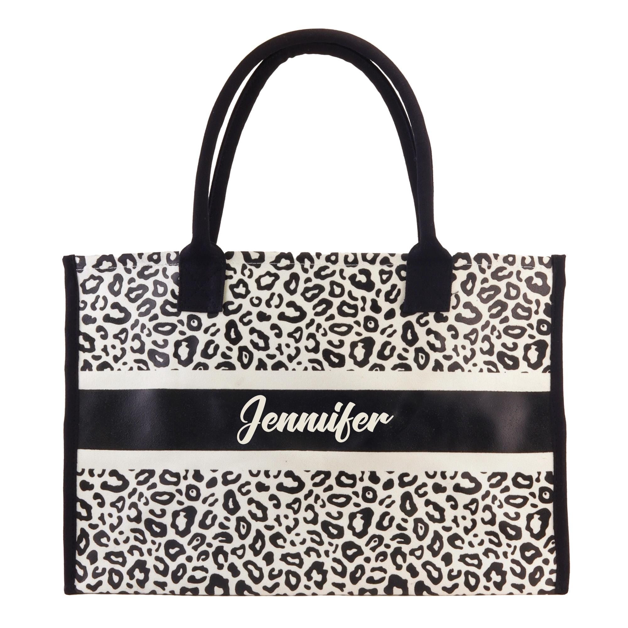 a leopard print bag with a name on it