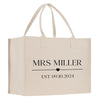 a white shopping bag with the words mrs miller on it