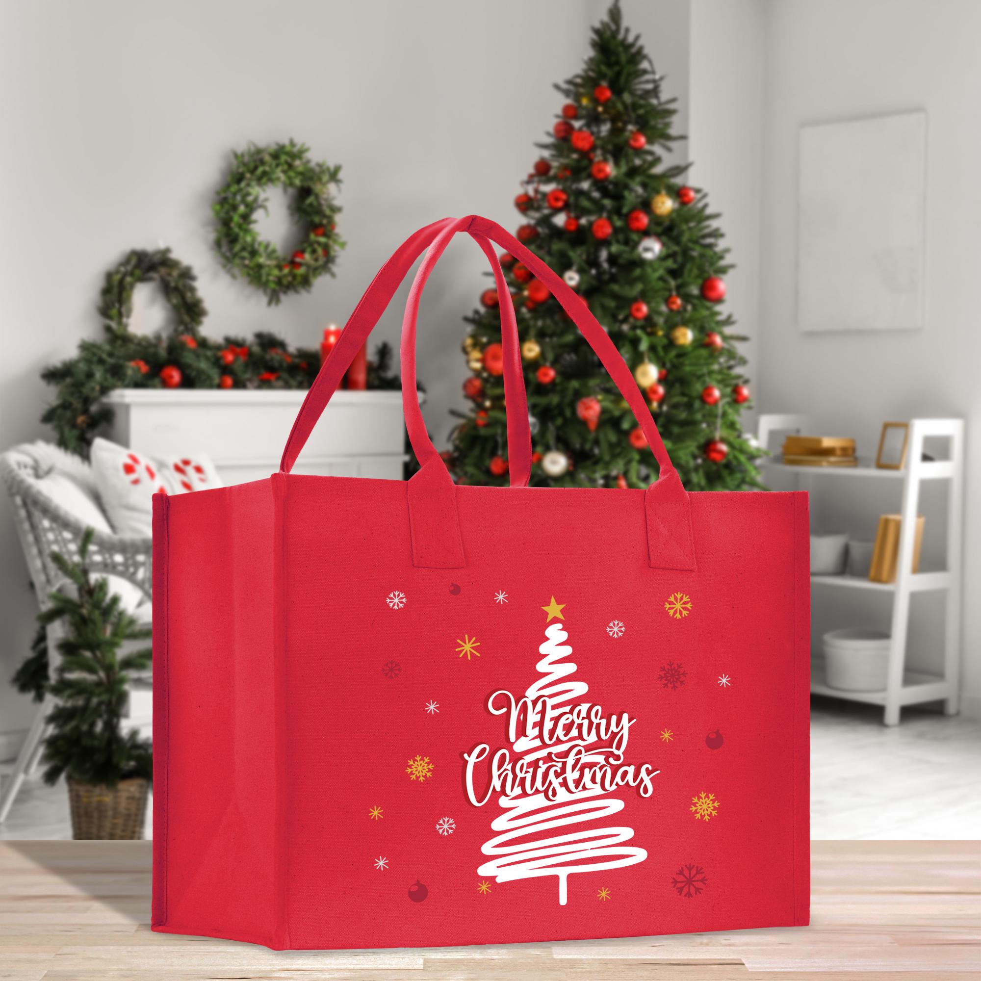 a red shopping bag with a christmas tree on it