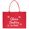 a red shopping bag with white writing on it