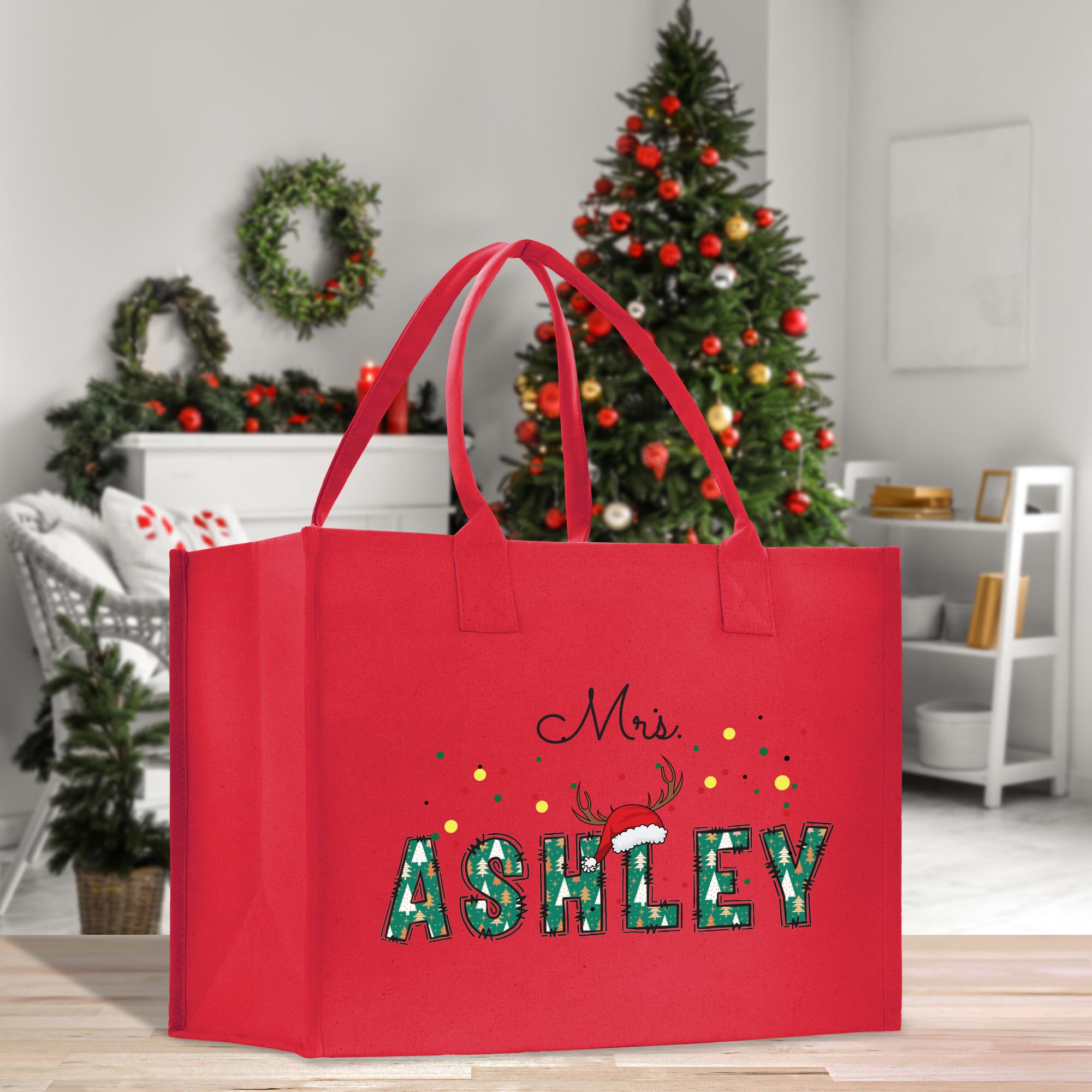 a red shopping bag with the words&#39;mrs ashley&#39;printed on it