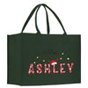 a green christmas shopping bag with mrs ashley on it