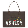 a brown shopping bag with the word ashley printed on it