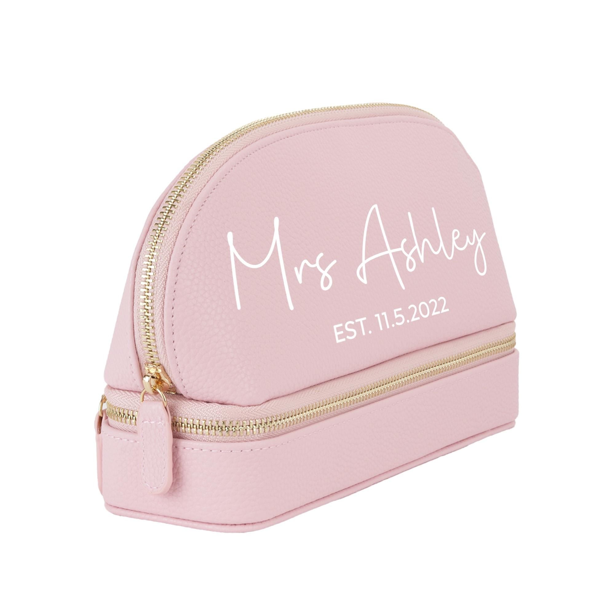 a pink makeup bag with a name on it