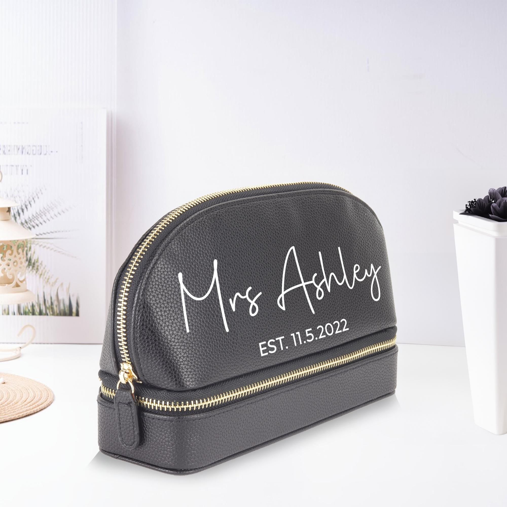 a personalized makeup bag next to a cup of coffee