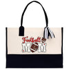 a black and white bag with a football mom on it