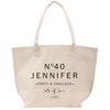 a white tote bag with a logo on it